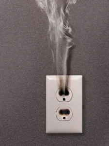 Hot electrical outlet pouring out smoke