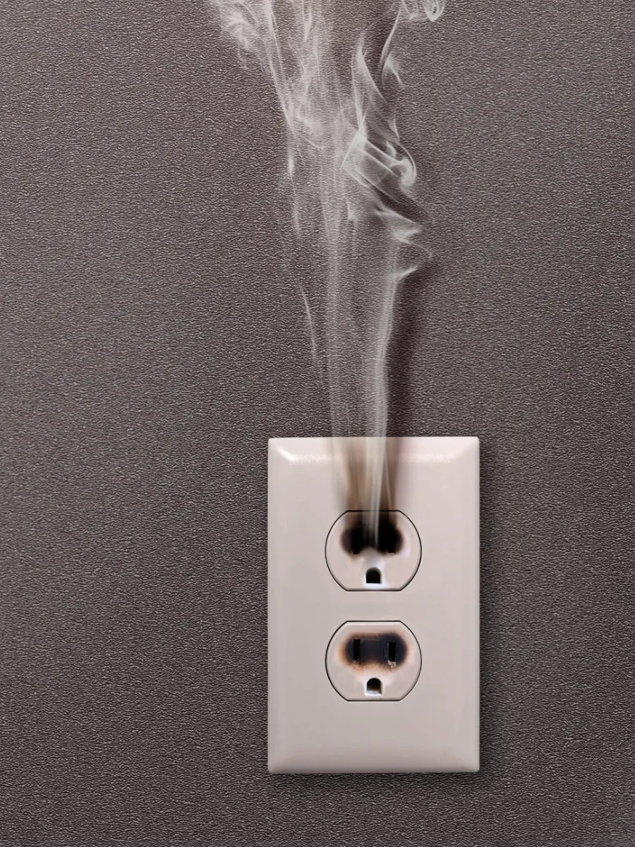 Hot electrical outlet pouring out smoke